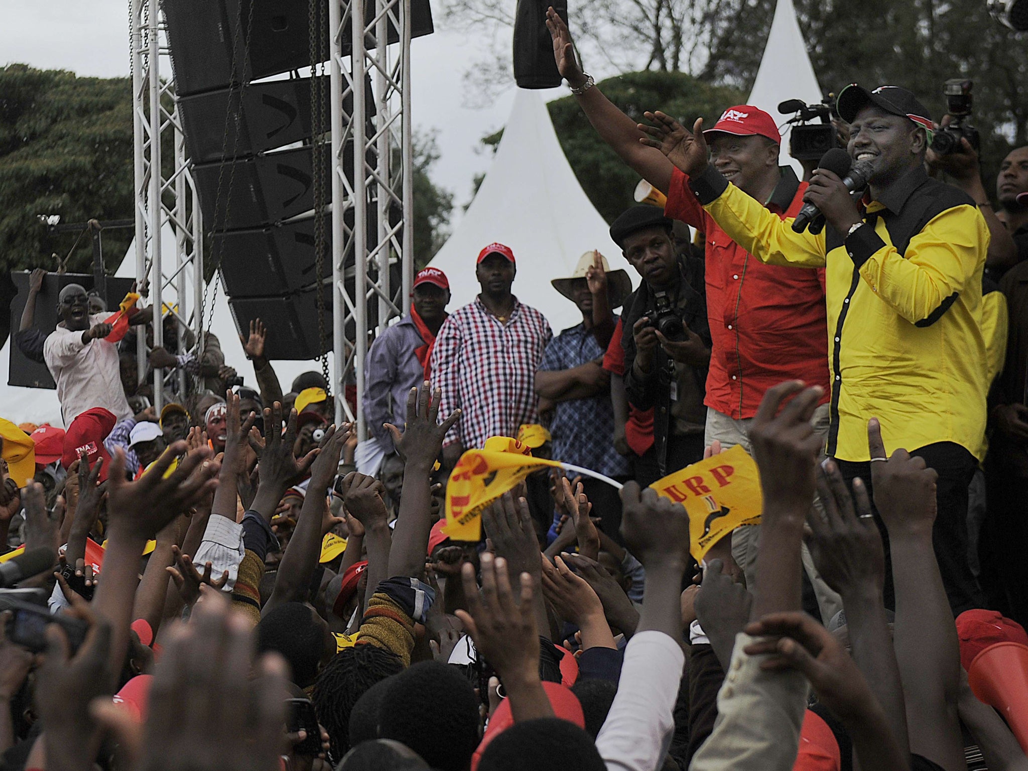 Uhuru Kenyatta, left, and William Ruto are accused of inciting tribal violence after the last election five years ago