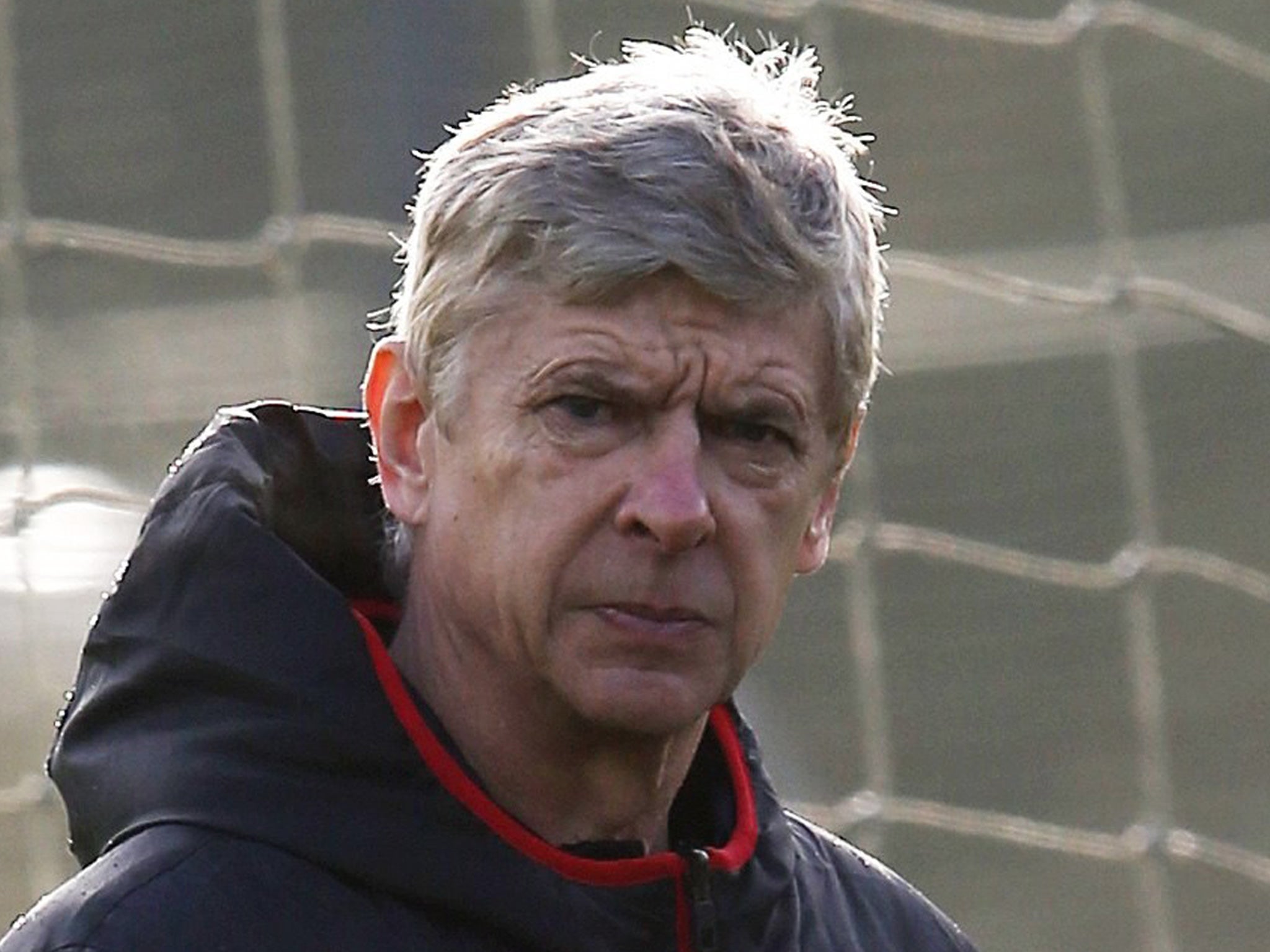 Arsène Wenger takes training at London Colney yesterday