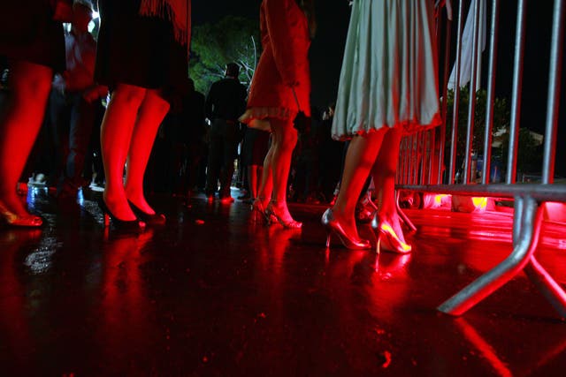 Women arrive to enter a nightclub during the 61st Cannes International Film Festival on May 17, 2008 in Cannes, southern France.
