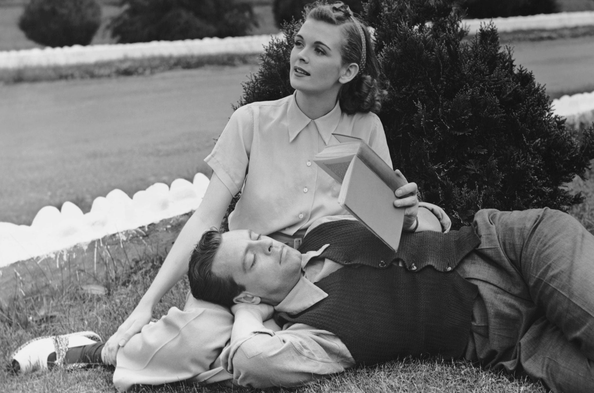 CIRCA 1950s: Couple outside.