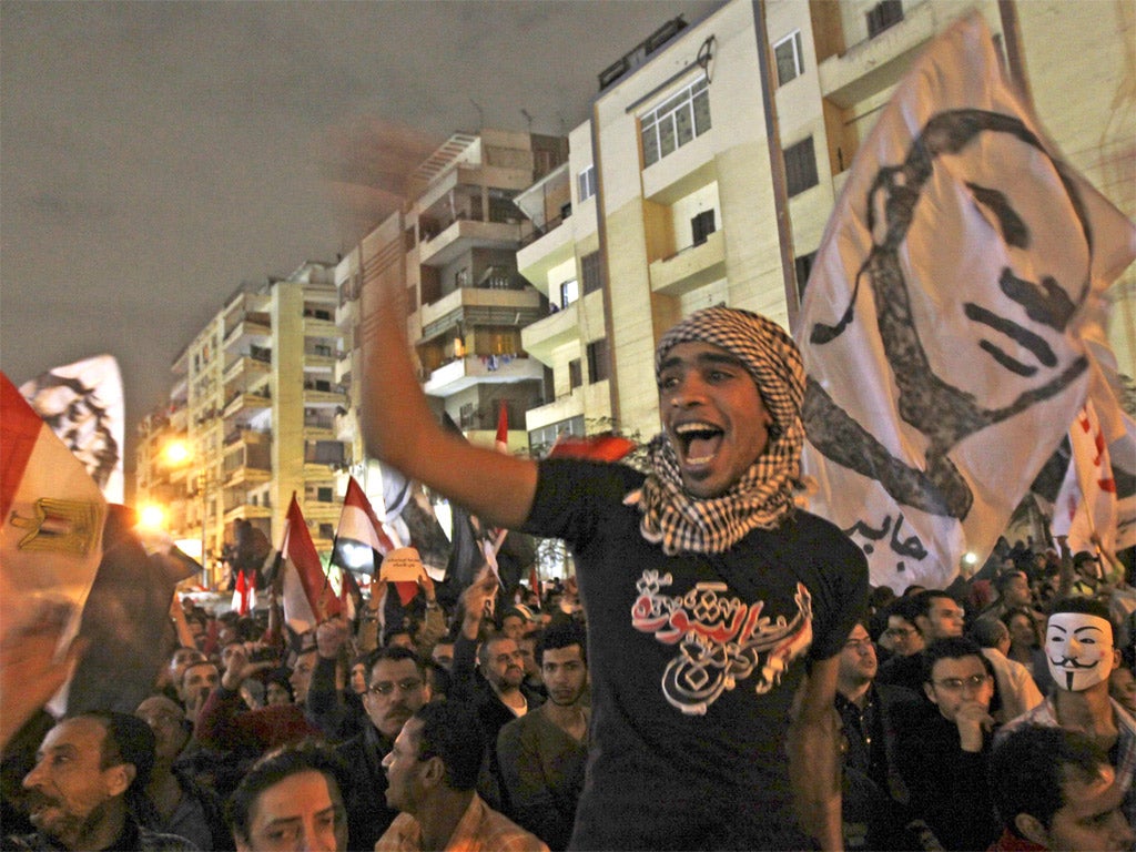 Protesters chant and wave flags in Cairo yesterday