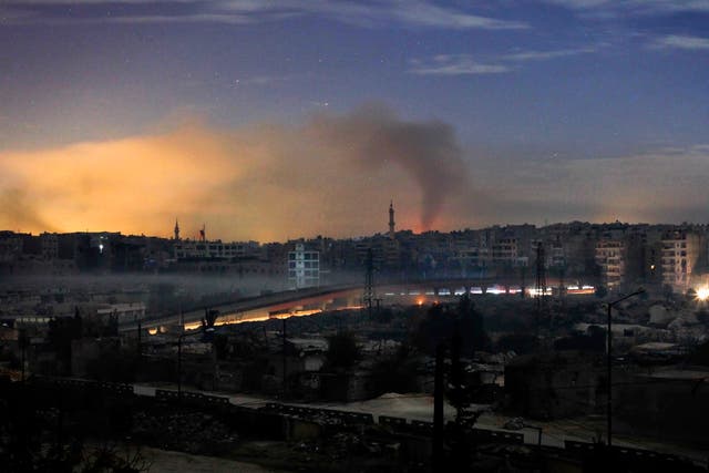 Smoke rises in the Hanano and Bustan al-Basha districts in the northern city of Aleppo on December 1, 2012 as fighting continues through the night. A large rebel force launched an offensive on one of the few army bases in northwestern Syria still in the h