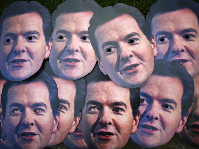 Masks depicting Chancellor George Osborne lie waiting to be used by members of the UNISON union near Parliament