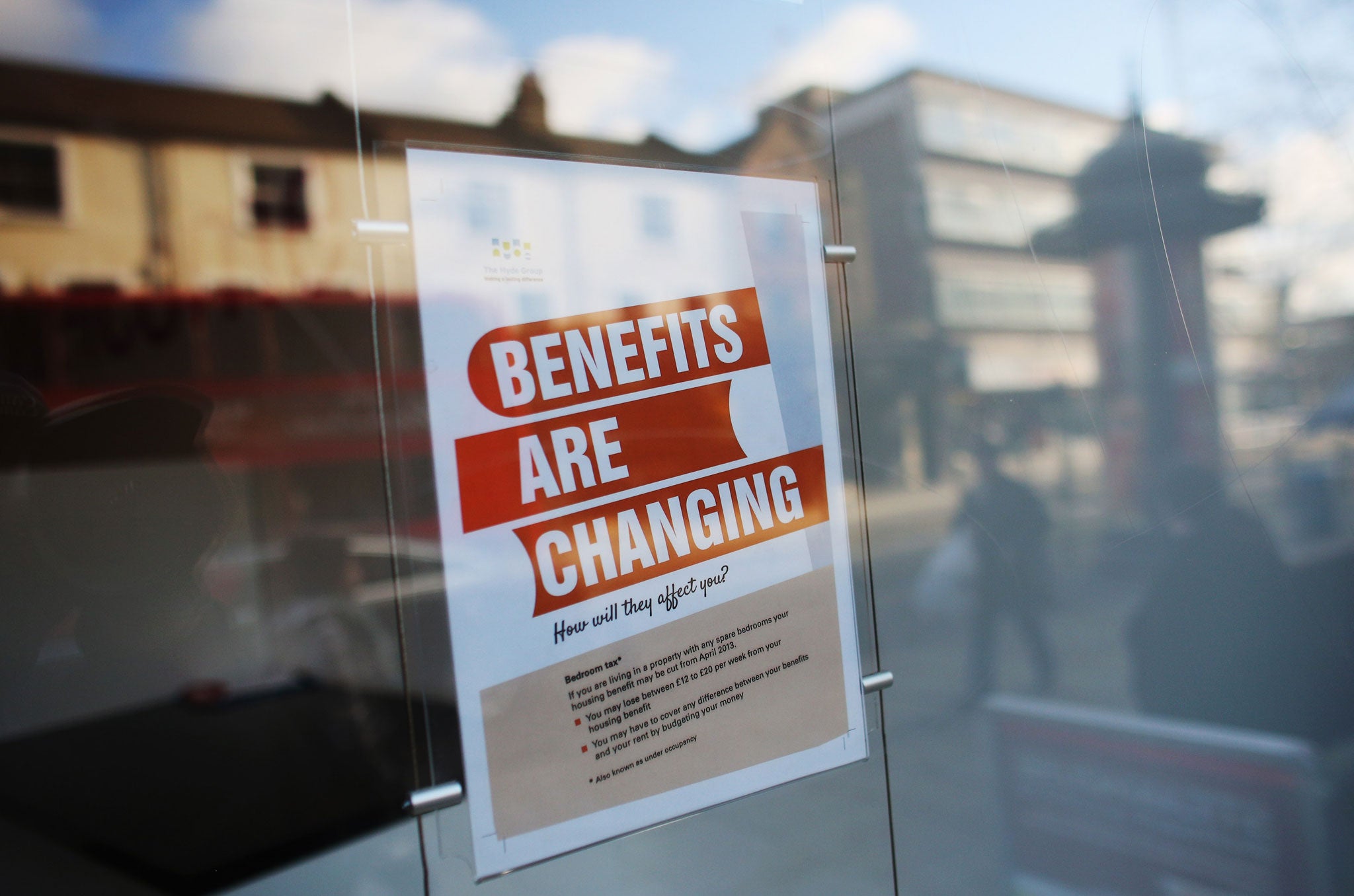 A sign informs members of the public on changes to Benefits on Lewisham high street on December 5, 2012 in London, England.
