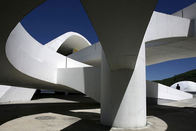 <p><strong>The Niteroi Museum of Contemporary  Art</strong></p>
<p>The flying saucer-shaped museum in Rio de Janeiro, which was
completed in 1996, has stunning views over Guanabara Bay and Sugarloaf
Mountain. Niemeyer worked with structural engineer Bruno Contarini to make the
16m high building, with a cupola 50m in diameter. His vision for the museum,
originally sketched out on a restaurant tablecloth, was one of &#x201c;rising upward,
like a flower, or a bird.&#x201d;</p>
<p>Mr Chapman said: &#x201c;The museum does look like it was dropped from
outer space.&#x201d;  While he does not rate the building as one of Niemeyer&#x2019;s
finest, he added: &#x201c;It is in the most stunning location. The setting and the
approach to the building are very dramatic.&#x201d;</p>
