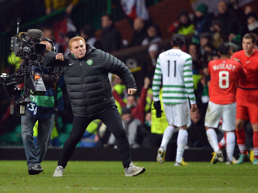 Neil Lennon celebrates progress in the Champions League for Celtic
