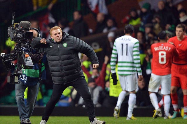 Neil Lennon celebrates progress in the Champions League for Celtic