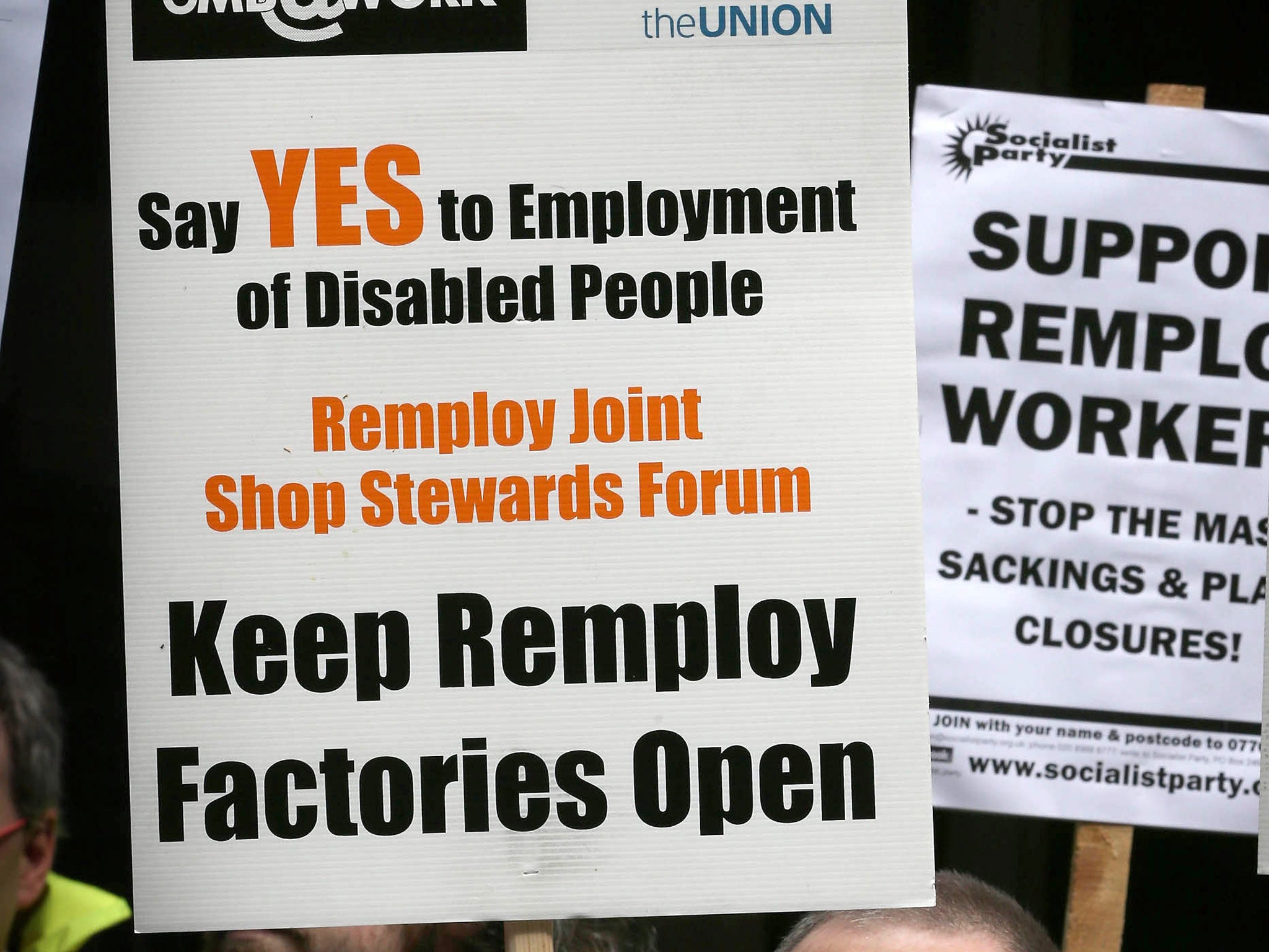 Banners from a protest in April this year demanding that Remploy factories stay open. The government plans to close 15 factories
