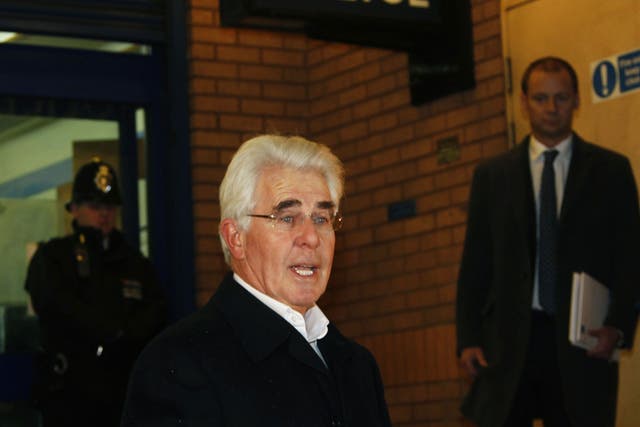 Max Clifford reads a statement after leaving Belgravia police station in London