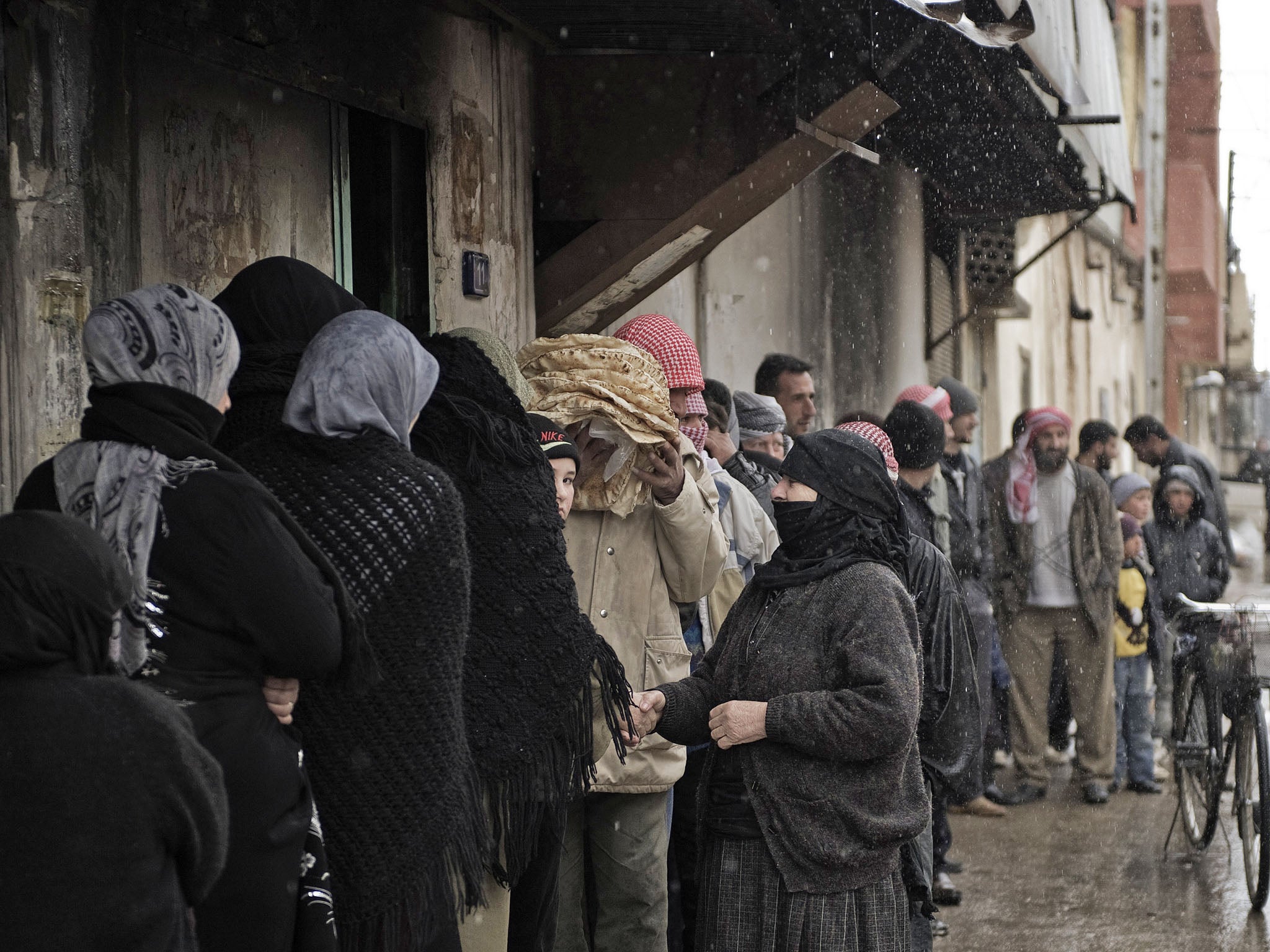 Syrians queue for bread