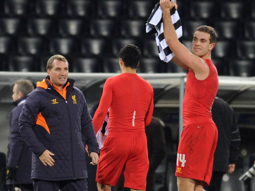 Brendan Rodgers watches Jordan Henderson leave the pitch against Udinese