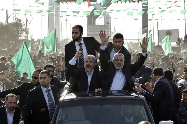 Hamas chief Khaled Meshaal, front left, alongside Hamas leader Ismail Haniyeh in Gaza yesterday