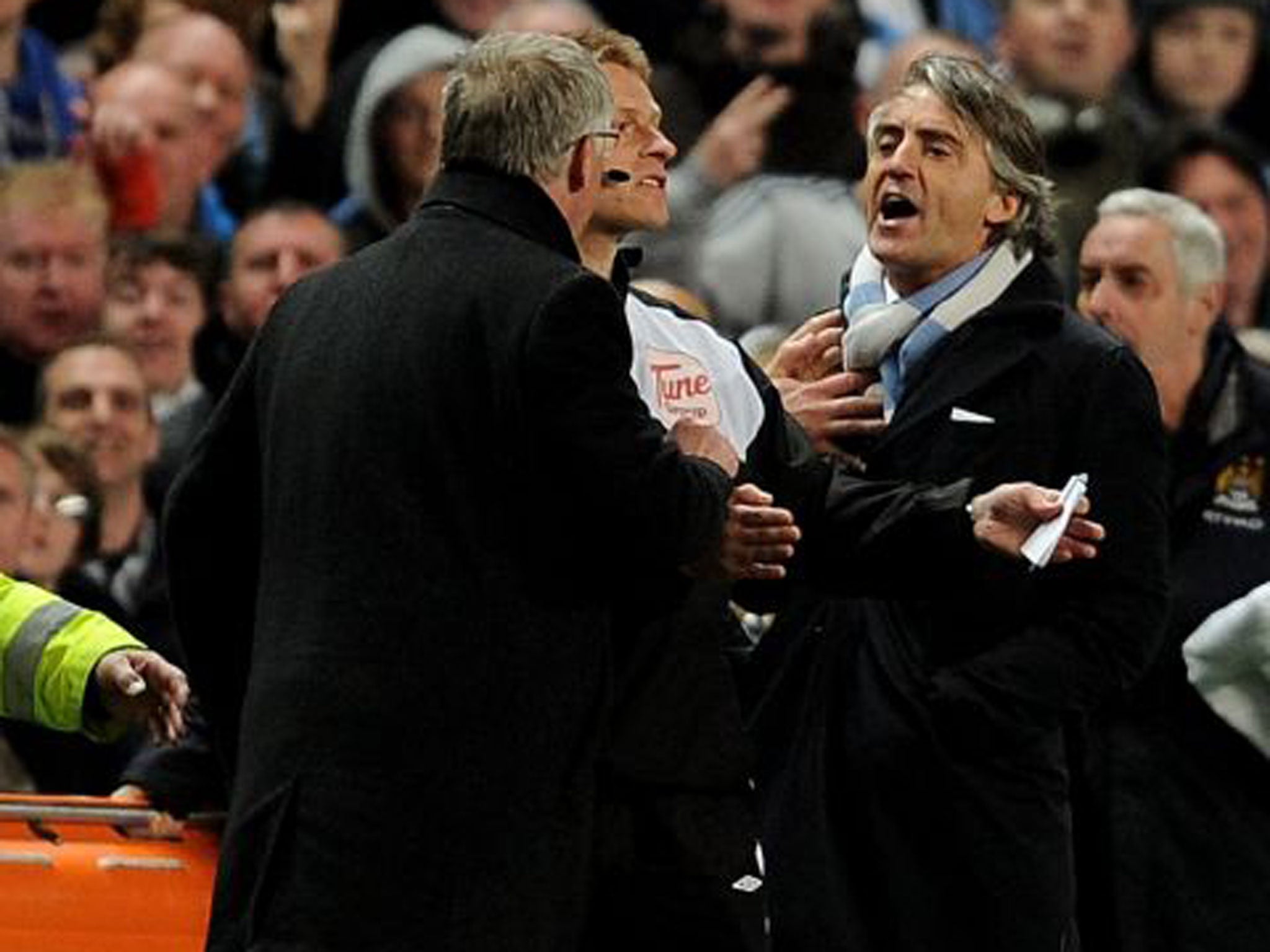 Roberto Mancini (right) and Alex Ferguson have a frank exchange of views at the Etihad in April