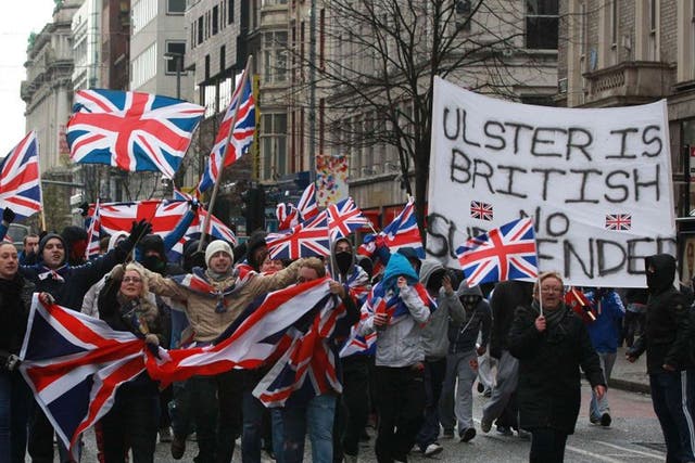 Loyalist march waving British Union Flags in Belfast