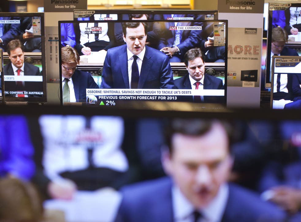 Double vision: Television screens relaying the Chancellor’s Autumn Statement