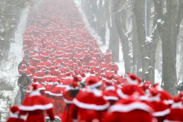 Runners dressed as Father Christmas take part in the so-called 'Nikolaus Run' in the East German town of Michendorf
