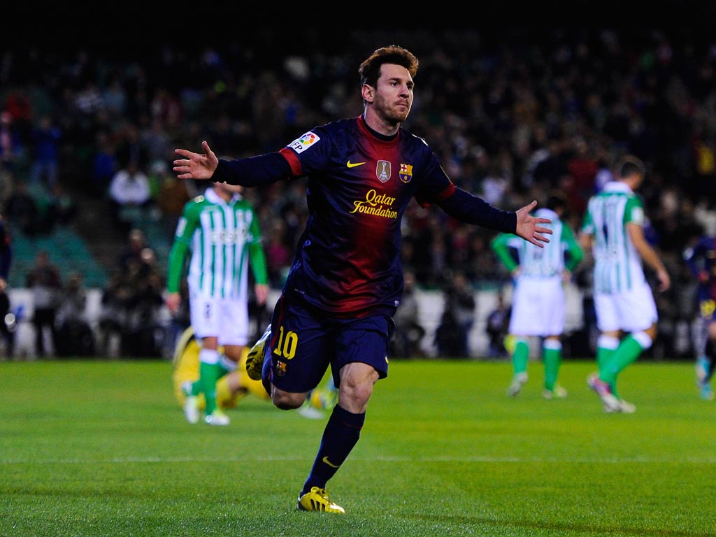 Messi celebrates the goal that took him equal with the record