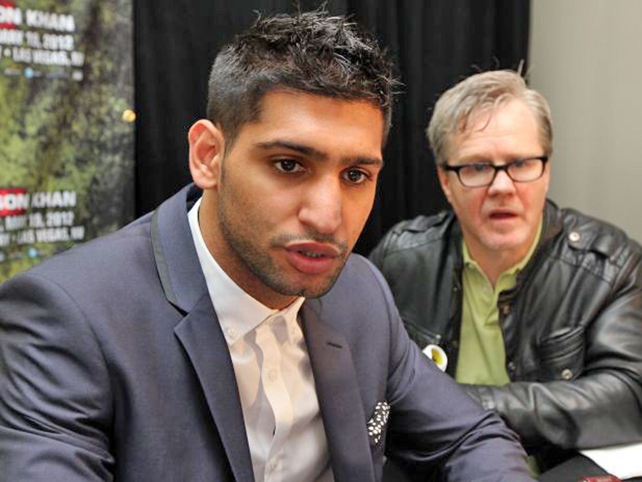 Amir Khan has parted company with Freddie Roach (right)