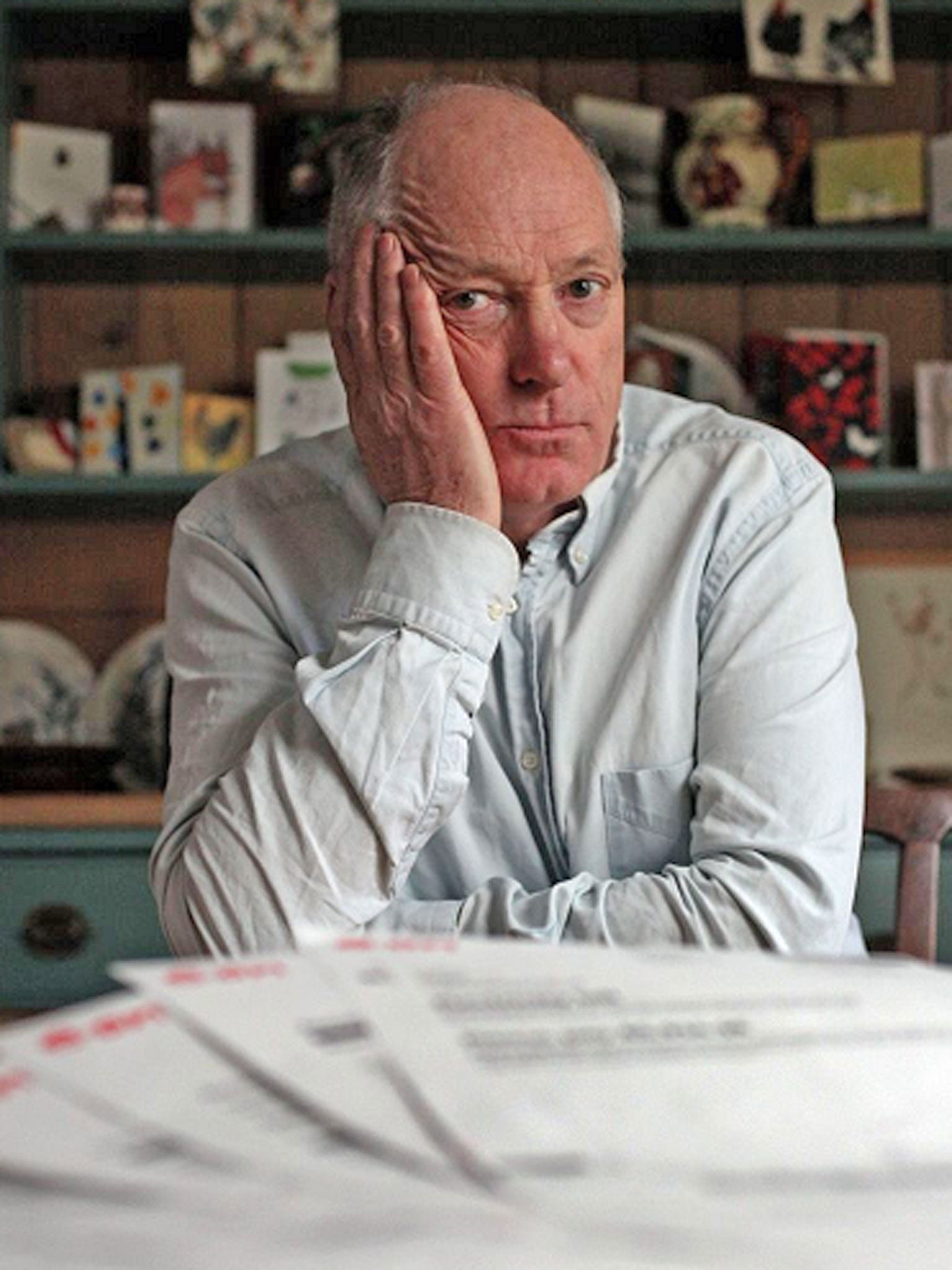 Terence Blacker at home with his baffling 20-page bill