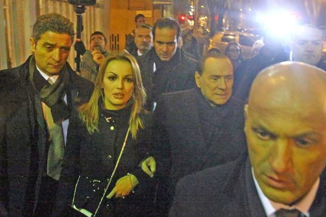 Silvio Berlusconi with his reported girlfriend, Francesca Pascale, after a PDL party meeting in Milan on Sunday night
