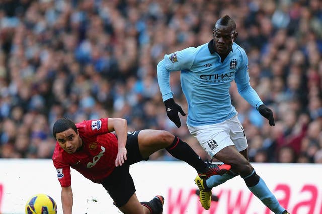 Mario Balotelli in action in the Manchester derby