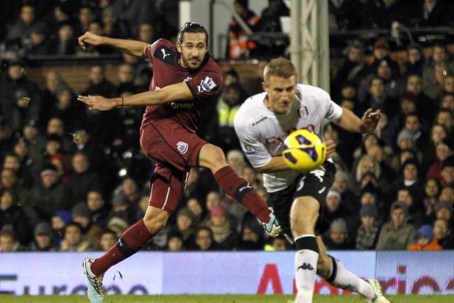 Newcastle United's Jonas Gutierrez has a shot blocked by Fulham defender Brede Hangeland 