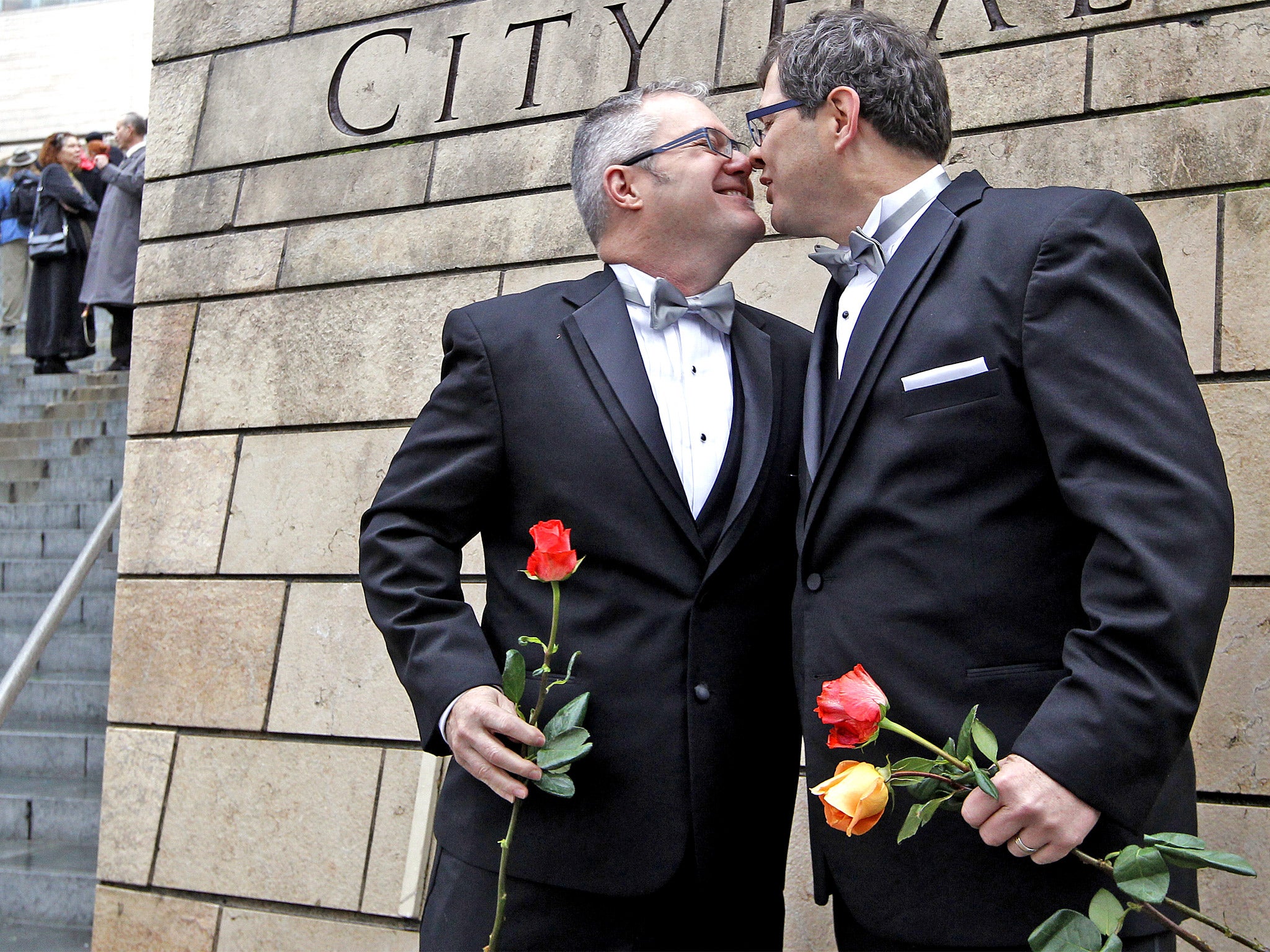 Terry Gilbert, left, and Paul Beppler were among the first gay couples to legally marry in Seattle at the weekend