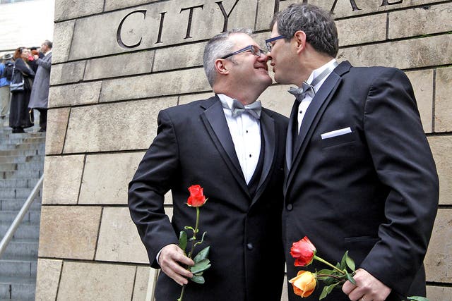 Terry Gilbert, left, and Paul Beppler were among the first gay couples to legally marry in Seattle at the weekend 