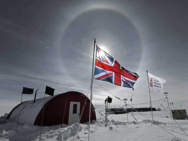 ANTARCTICA: The sun shines through a British flag over the field camp of the Lake Ellsworth drilling project in near the Ellsworth Mountains of Antarctica.
