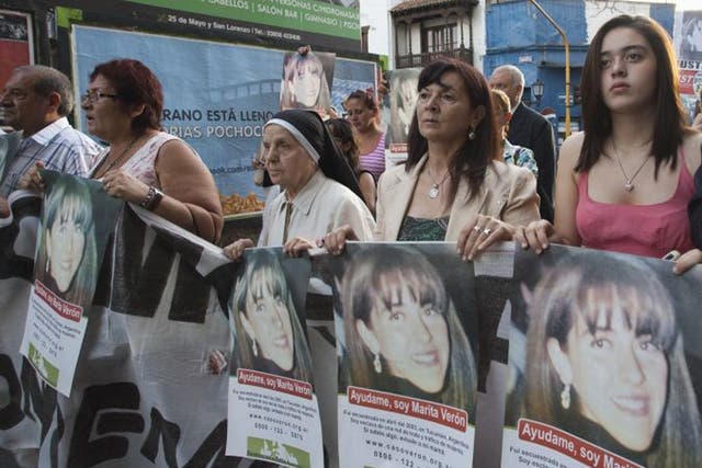 Susana Trimarco, second from right, and her granddaughter Micaela, right, lead a march towards the courthouse during the trial