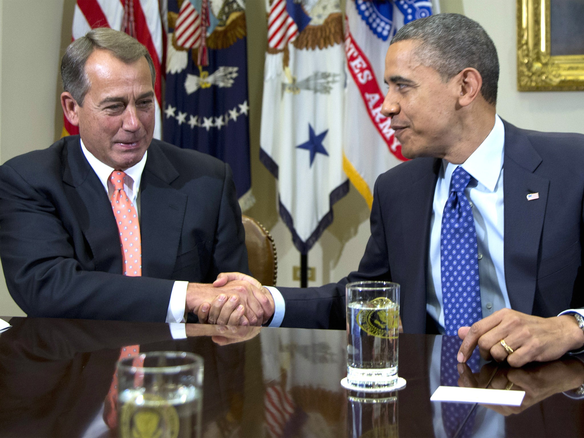 The House Speaker John Boehner, left, and President Barack Obama are seeking to resolve serious differences