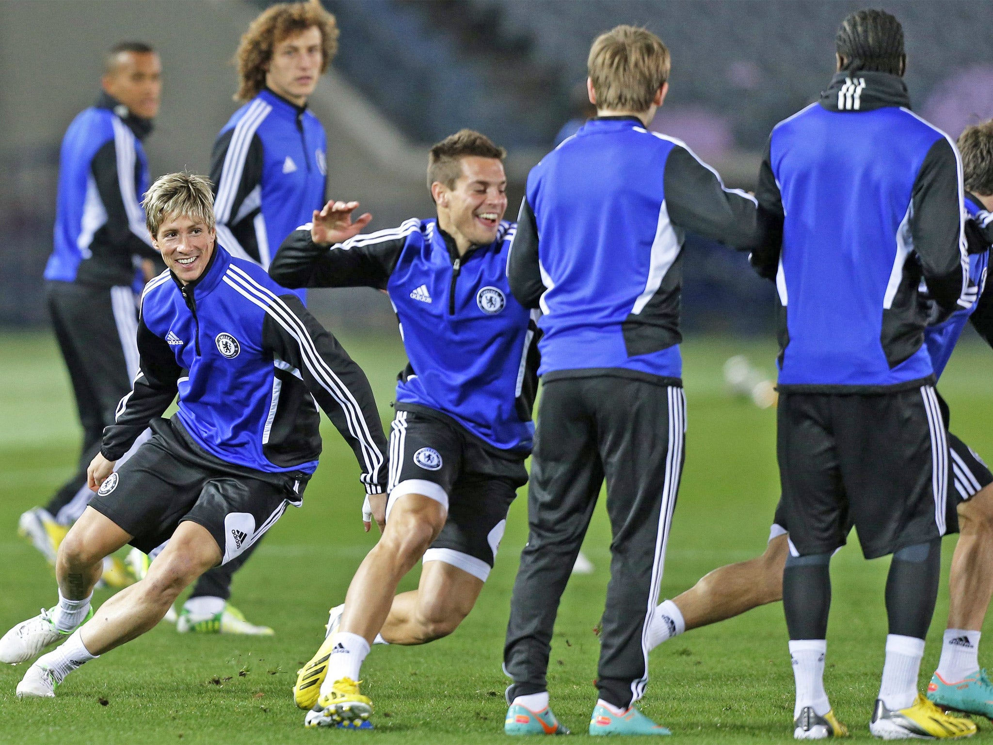 Fernando Torres (left) jokes with his Chelsea team-mates in Yokohama