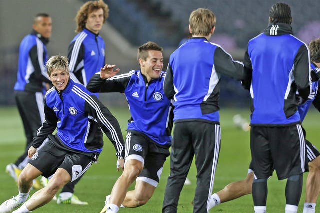 Fernando Torres (left) jokes with his Chelsea team-mates in Yokohama