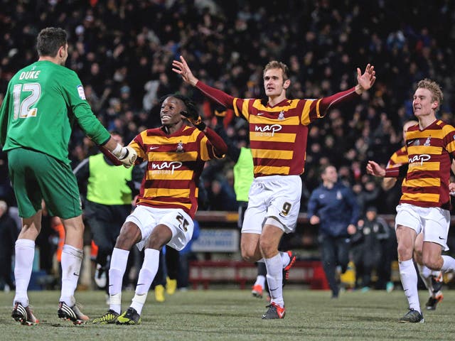 Elated Bradford players celebrate a historic victory