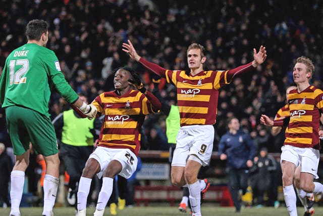 Elated Bradford players celebrate a historic victory