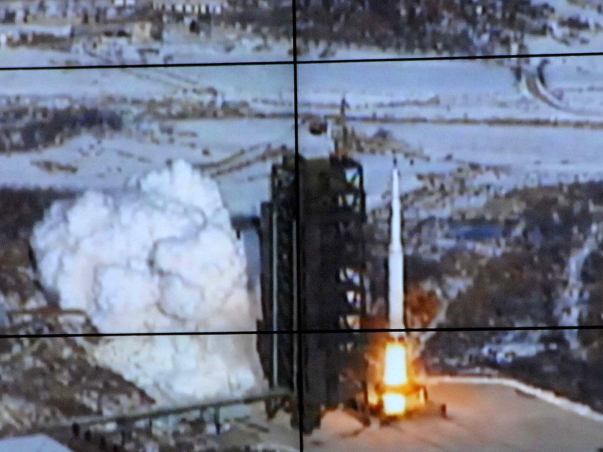 This picture received from North Korea's official Korean Central News Agency on December 12, 2012 shows the rocket Unha-3, carrying the satellite Kwangmyongsong-3, being monitored on a large screen at a satellite control center in Cholsan county, North Pyongan province in North Korea. North Korea confirmed it had launched a long-range rocket and succeeded in its mission of placing a satellite into orbit.
