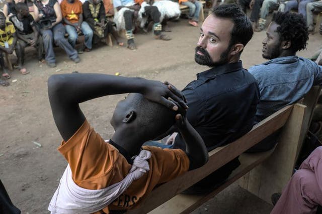 UNICEF Ambassador Ishmael Beah and Evgeny Lebedev speak to children who have been rescued by UNICEF from armed groups and are now receiving support at a transit centre in Bria where they can reclaim their childhoods and rebuild their lives. 