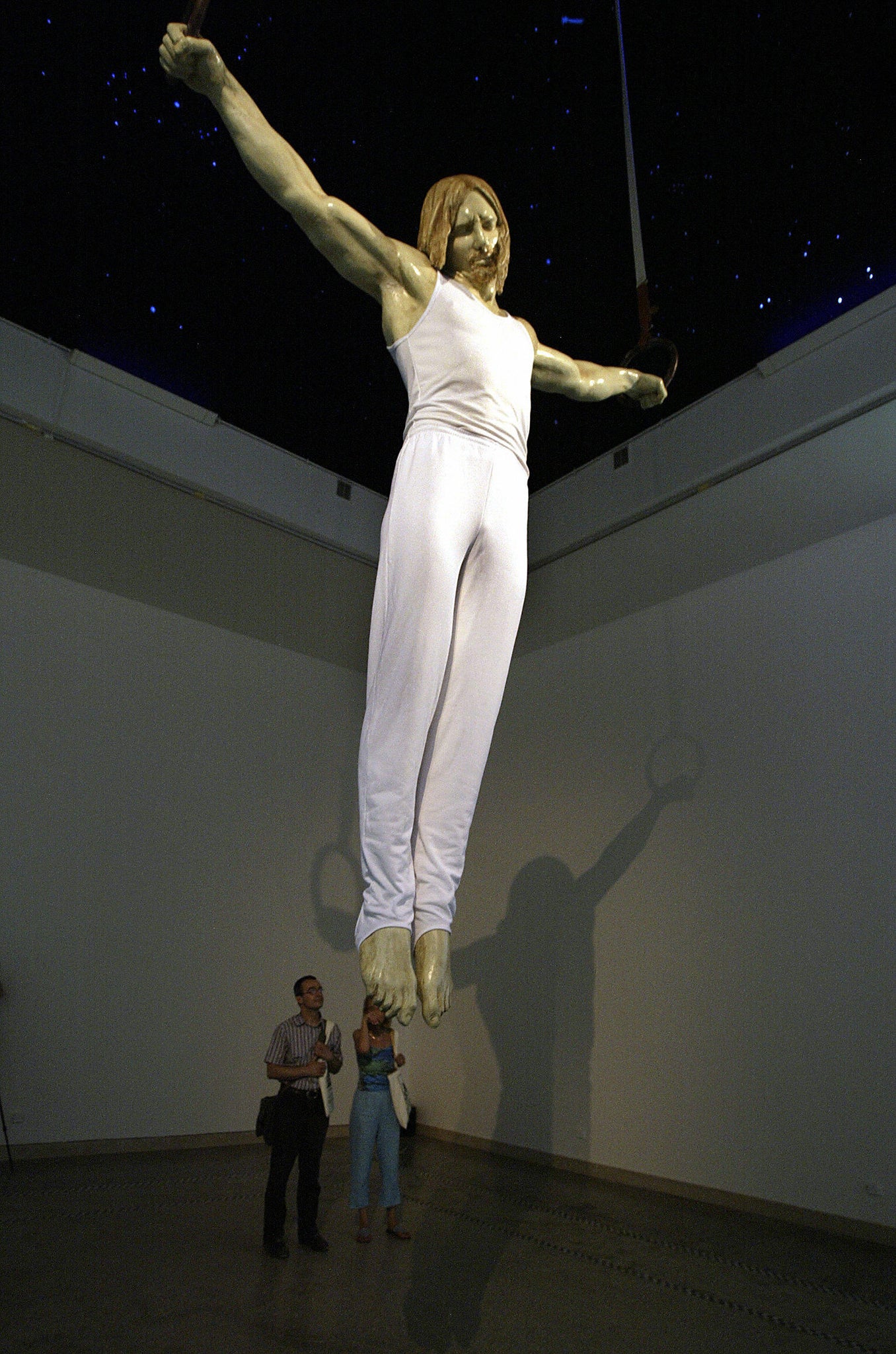 A figure of Jesus Christ as a gymnast, by Czech sculptor Michal Kolecek, in the Czech Pavillon, during the 5Oth Biennale of Art in Venice, 2003