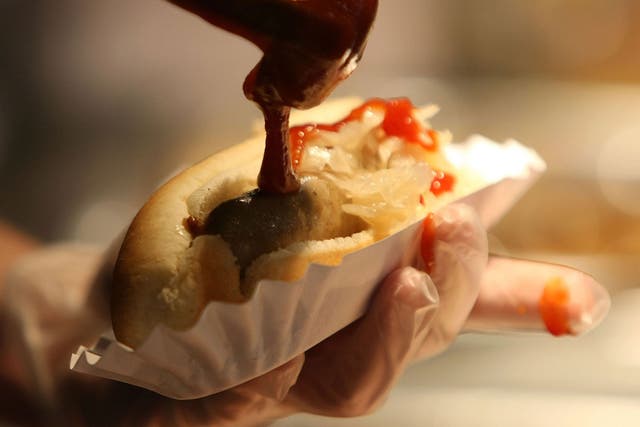 Sauce is poured onto a hot dog — but what lurks inside the sausage?
