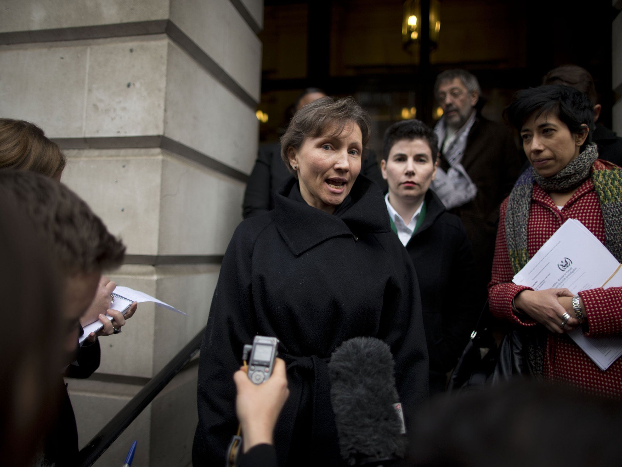 Marina Litvinenko, centre, the widow of former Russian intelligence officer Alexander Litvinenko, leaves a pre-inquest review