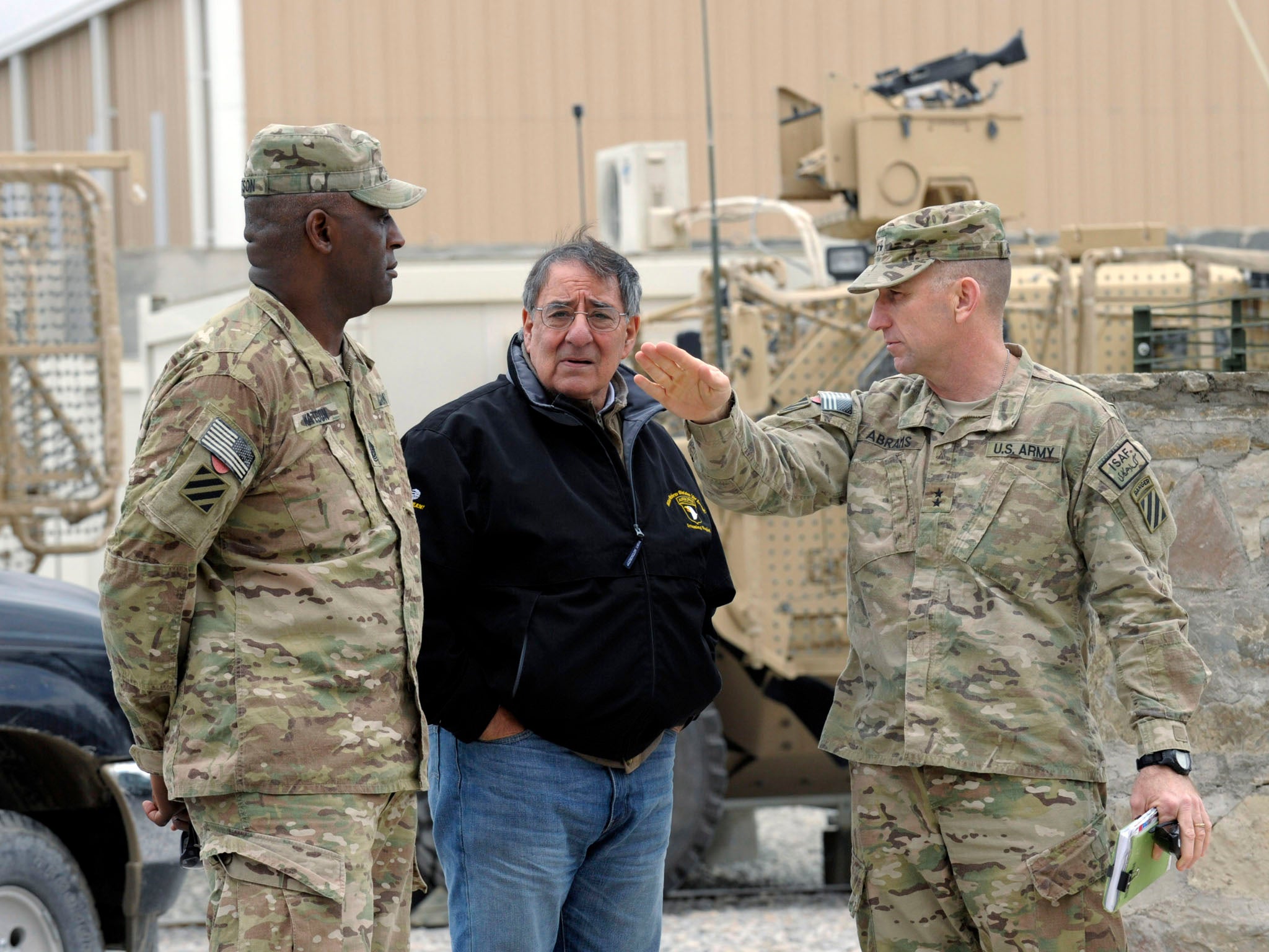 US Defense Secretary Leon Panetta talks with Army Maj. Gen. Robert Abrams, (R) and Command Sgt. Maj. Edd Watson, (L) during a visit to Kandahar Airfield