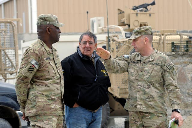 US Defense Secretary Leon Panetta talks with Army Maj. Gen. Robert Abrams, (R) and Command Sgt. Maj. Edd Watson, (L) during a visit to Kandahar Airfield