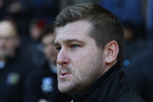 Karl Robinson manager of MK Dons looks on prior to the FA Cup with Budweiser Second Round match between MK Dons and AFC Wimbledon