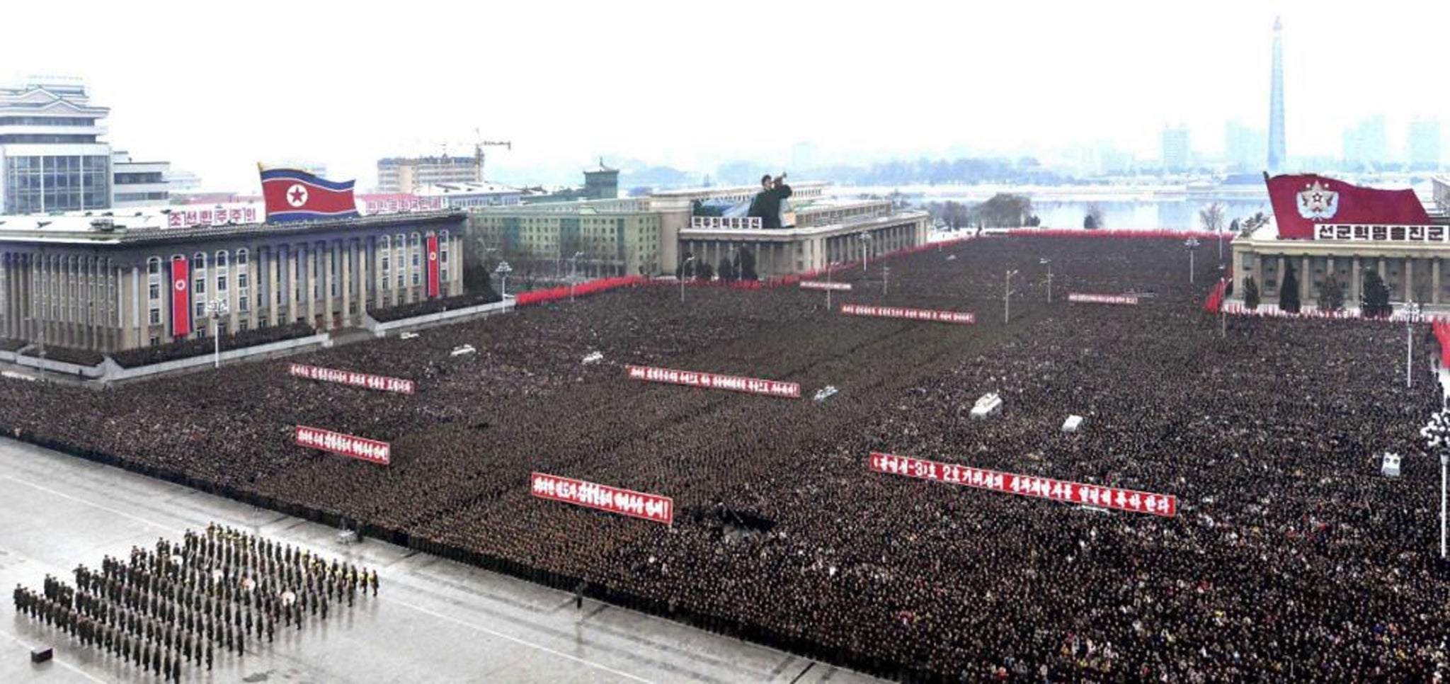 North Koreans attend a rally to celebrate the successful launch of the Unha-3 (Milky Way 3) rocket