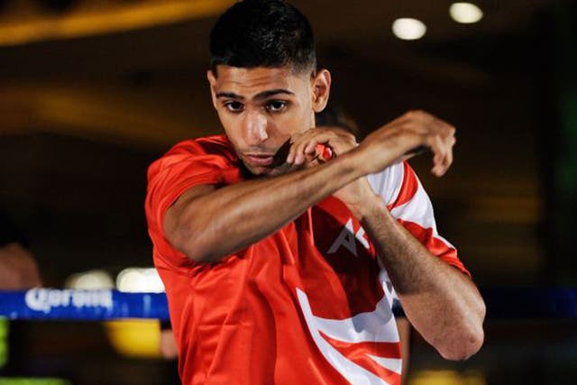 Amir Khan has been defeated three times as a pro boxer but hopes for a fresh start with new trainer Virgil Hunter 
