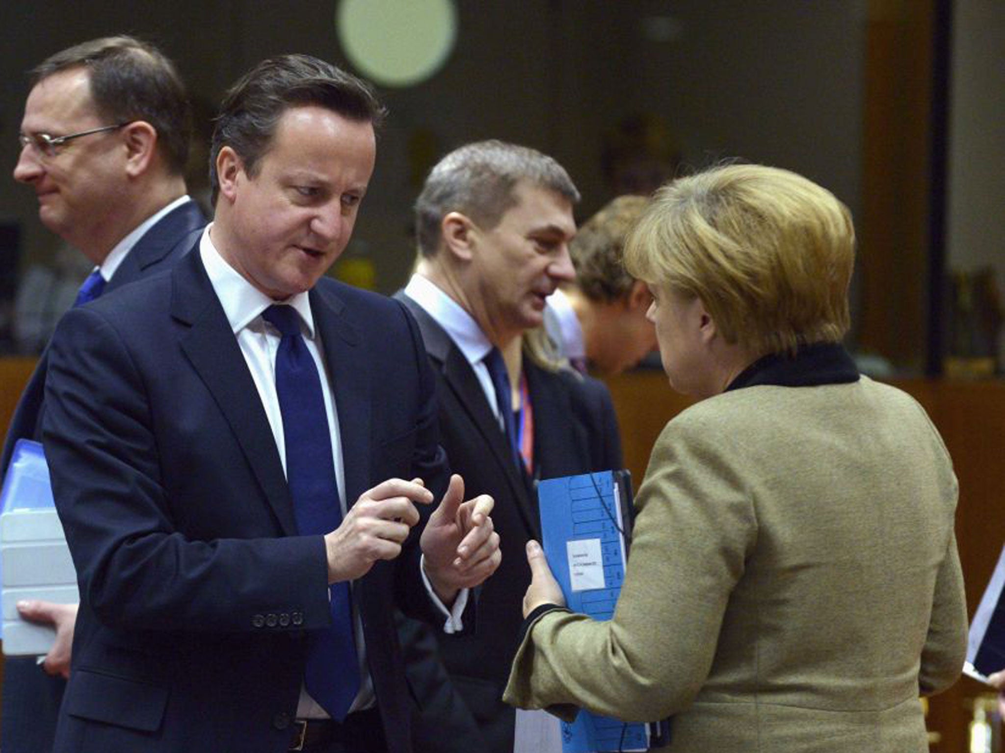 David Cameron puts his case to the German Chancellor, Angela Merkel, in Brussels yesterday