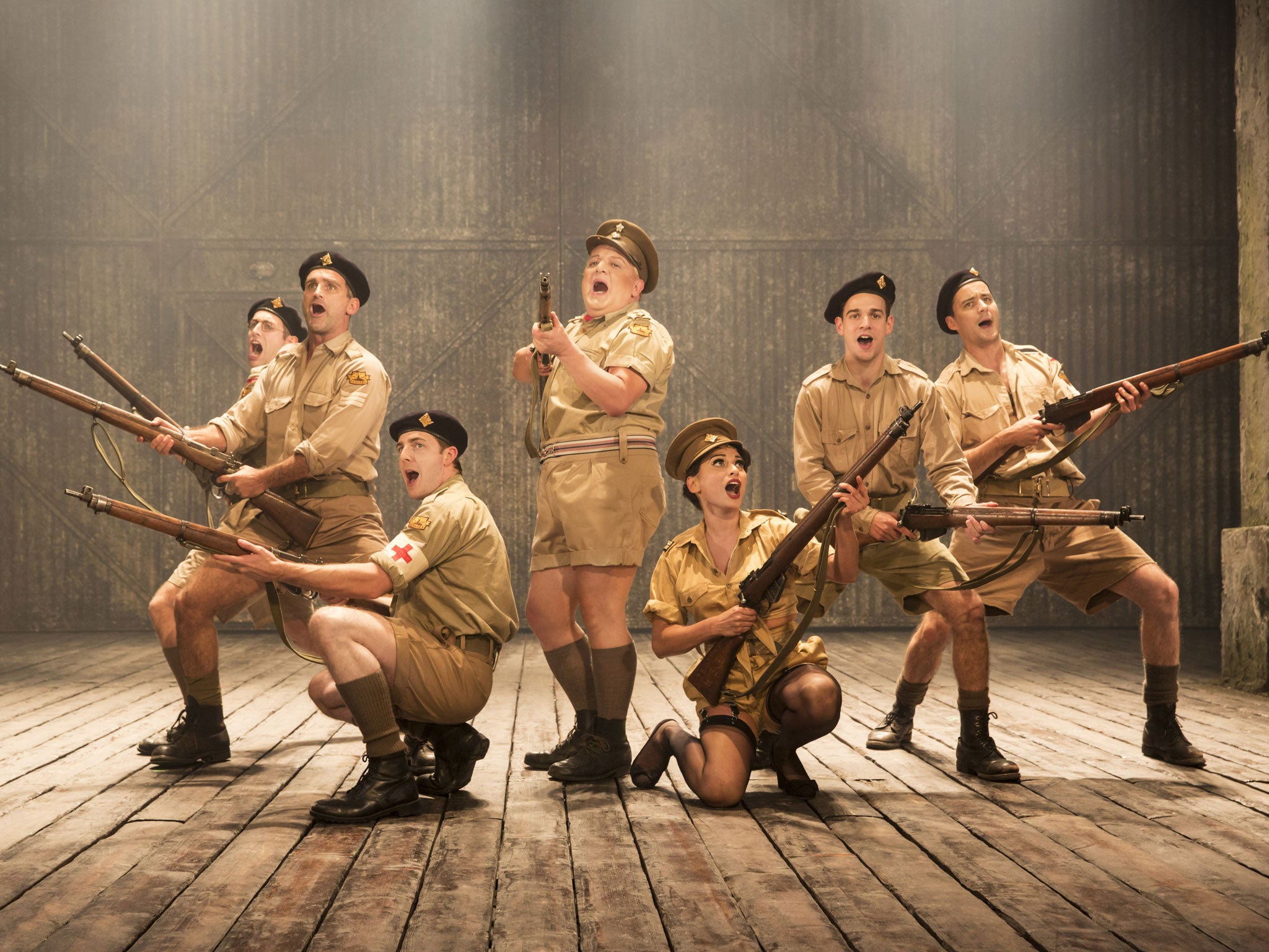 Knees up: Simon Russell Beale, centre, camps it up in Privates on Parade