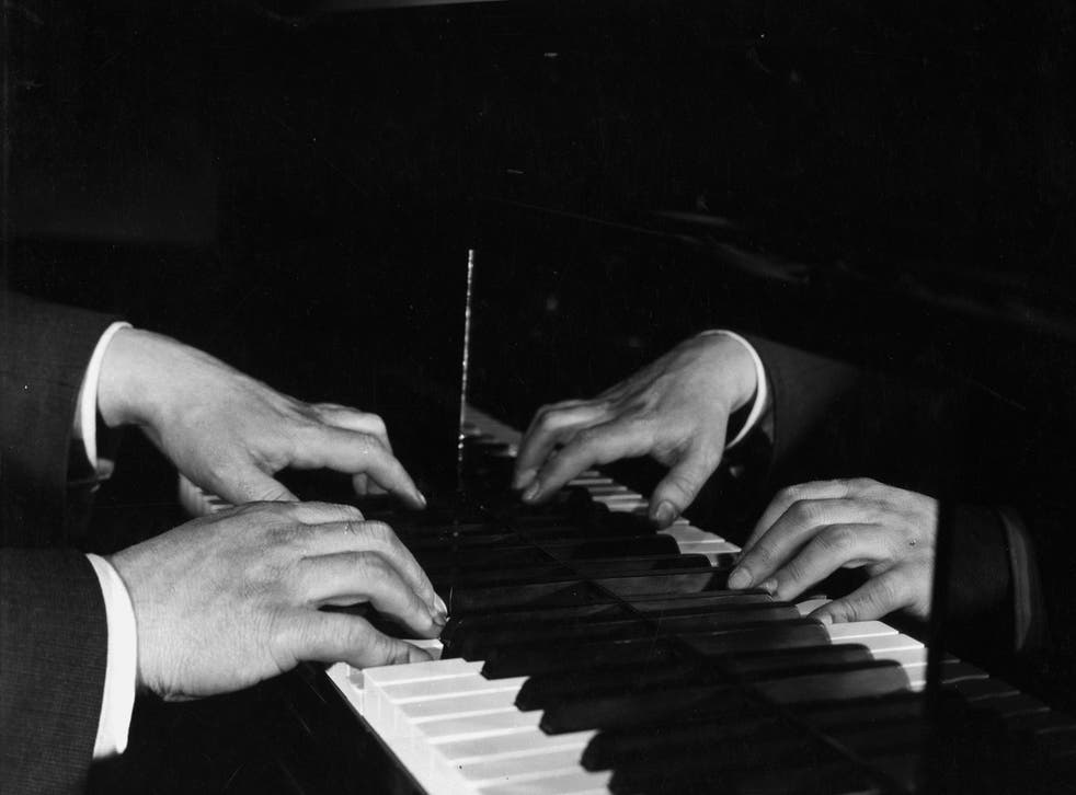 circa 1925: The hands of pianist, York Bowen, tickling the ivories.