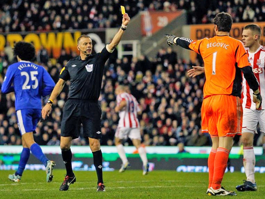 Stoke’s Asmir Begovic is booked by Mark Halsey on Saturday