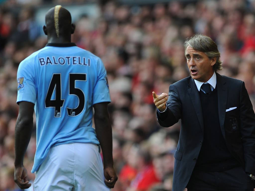 Mario Balotelli and Roberto Mancini